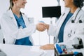 Doctor, handshake and partnership in healthcare, medicine or trust for collaboration, unity or support.Team of medical experts Royalty Free Stock Photo