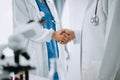 Doctor, handshake and partnership in healthcare, medicine or trust for collaboration, unity or support.Team of medical experts Royalty Free Stock Photo