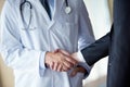 Doctor handshake with a patient