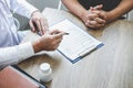 Doctor having conversation with patient while discussing explaining symptoms or counsel diagnosis health and consult treatment of