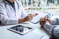 Doctor having conversation with patient while discussing explaining symptoms or counsel diagnosis health and consult treatment of Royalty Free Stock Photo