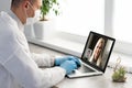 Doctor Having Video Conference On Laptop With Colleagues Royalty Free Stock Photo