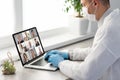 Doctor Having Video Conference On Laptop With Colleagues Royalty Free Stock Photo