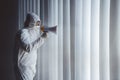 Doctor in hazmat suit shouting with megaphone Royalty Free Stock Photo
