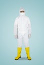 Doctor in hazmat suit standing in studio