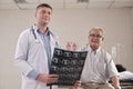 Doctor health checks elderly patient in bed of emergency room at hospital ward Royalty Free Stock Photo