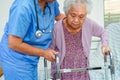 Doctor help Asian elderly woman disability patient in nursing hospital, medical concept