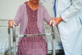 Doctor help Asian elderly woman disability patient in nursing hospital, medical concept