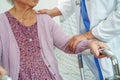 Doctor help Asian elderly woman disability patient in nursing hospital, medical concept