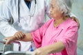 Doctor help and care Asian senior or elderly old lady woman use walker with strong health Royalty Free Stock Photo