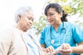 Doctor help and care Asian senior or elderly old lady woman walking at park in happy fresh holiday Royalty Free Stock Photo