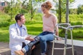 Doctor helping a young woman during reeducation Royalty Free Stock Photo