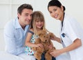 A doctor and her patient examining a teddy bear Royalty Free Stock Photo
