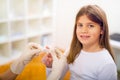 Doctor in her practice putting a bandage on a little girl Royalty Free Stock Photo