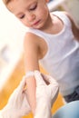 Doctor in her practice putting a bandage on some hurt of a little boy Royalty Free Stock Photo