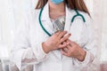 Doctor hiding dollar bribe into robe, corruption in medicine
