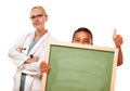 Doctor with Hispanic Child Holding Chalk Board Royalty Free Stock Photo