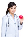 Doctor hold heart shape ball