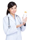 Doctor hold water bottle