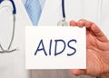 Doctor holding AIDS sign with text Royalty Free Stock Photo
