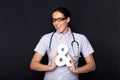 Doctor holding an ampersand symbol