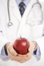 Doctor holding apple. Royalty Free Stock Photo