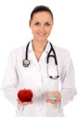 Doctor holding apple and pills Royalty Free Stock Photo