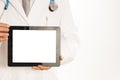 Doctor holding blank digital tablet on white background Royalty Free Stock Photo