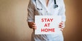 Doctor holding blank white banner