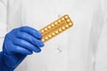 Doctor holding blister of oral contraception pills, closeup Royalty Free Stock Photo