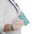 Doctor holding blister of oral contraception pills on white background, closeup Royalty Free Stock Photo