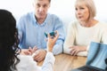 Physician giving asthma inhaler to elderly couple Royalty Free Stock Photo