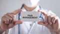 Doctor holding card. Pain Management Royalty Free Stock Photo