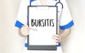 Doctor holding a card with text BURSITIS,medical concept