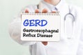 Doctor holding a card with text GERD - Gastroesophageal Reflux Disease - medical concept Royalty Free Stock Photo