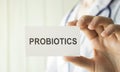 Doctor holding a card with text Probiotics