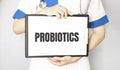 Doctor holding a card with text PROBIOTICS, medical concept