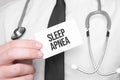 Doctor holding a card with text Sleep Apnea,medical concept