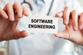 Doctor holding a card with text Software Engineering Royalty Free Stock Photo