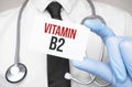 Doctor holding a card with text vitamin b2,medical concept