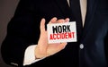 Doctor holding a card with text Work Accident, medical concept Royalty Free Stock Photo
