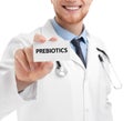 Doctor holding card with word PREBIOTICS on white background, closeup