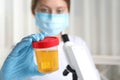 Doctor holding container with sample for analysis Royalty Free Stock Photo