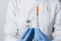 Doctor holding coronavirus vaccine. Close-up covid-19 Vaccination. Stop quarantine Royalty Free Stock Photo