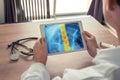 Doctor holding a digital tablet with x-ray of chest and pain on the spine