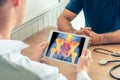 Doctor holding a digital tablet with x-ray of hips and spine of the patient Royalty Free Stock Photo