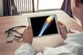 Doctor holding a digital tablet with x-ray of leg and pain on the external knee Royalty Free Stock Photo