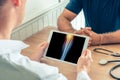 Doctor holding a digital tablet with x-ray of leg of the patient. Knee with pain Royalty Free Stock Photo