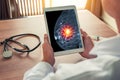 Doctor holding a digital tablet with xray mammogram skeleton. Breast cancer prevention