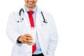 Doctor holding glass of milk in front of chest, good for osteoporosis and bone health